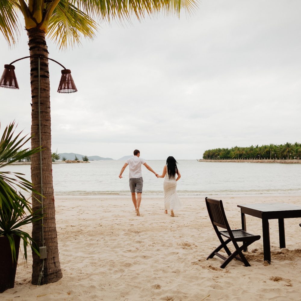 honeymoon couple relax on beach